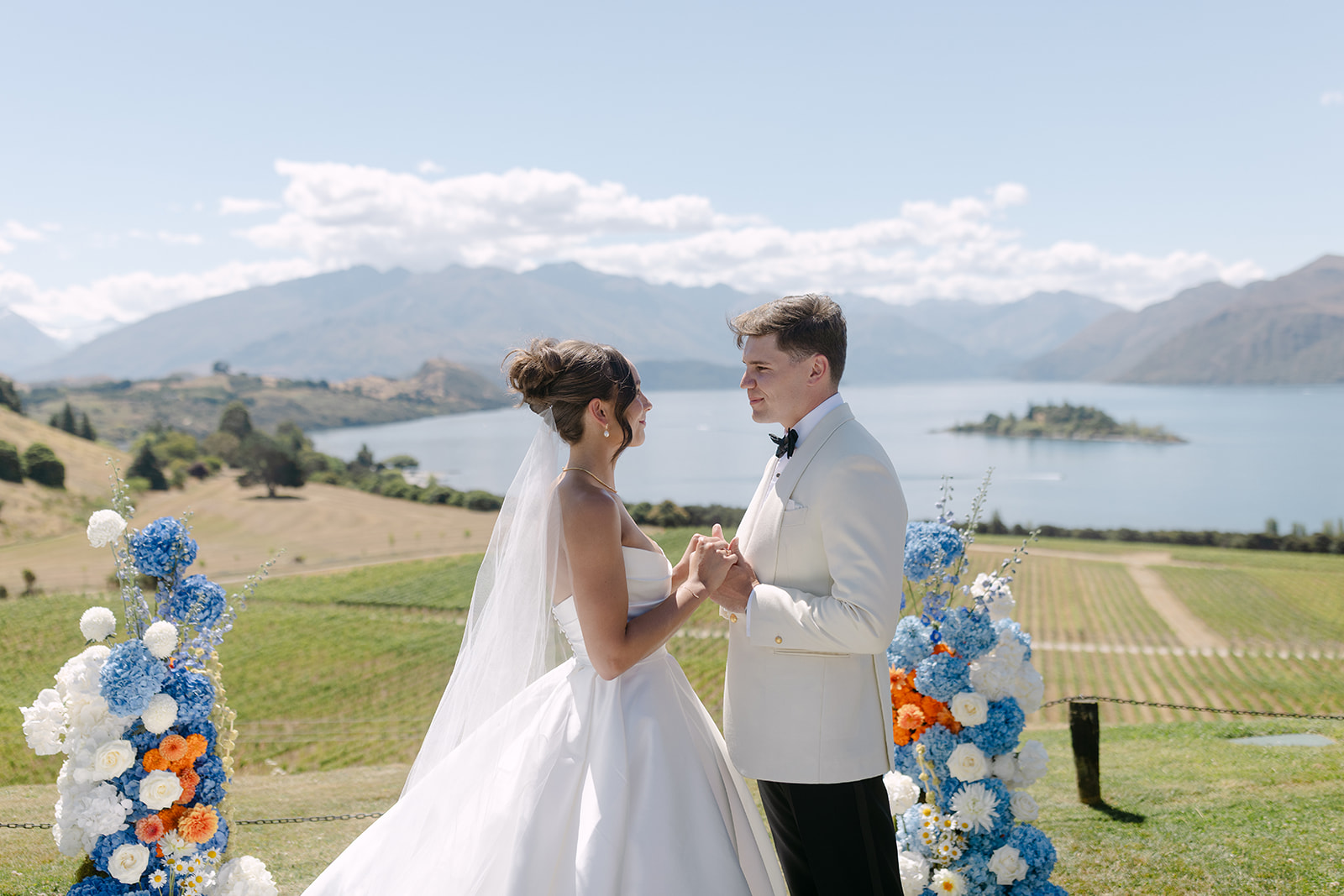 Bride and Groom at ceremony in front of Lake Wanaka and mountain backdrop